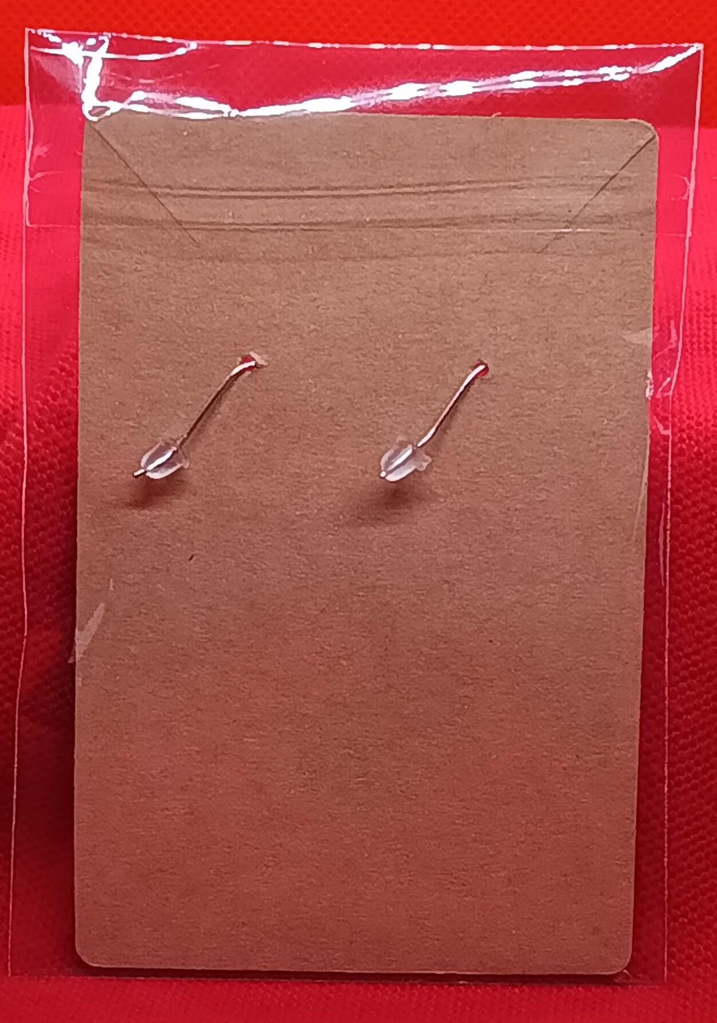 Dinosaur and meteor earrings