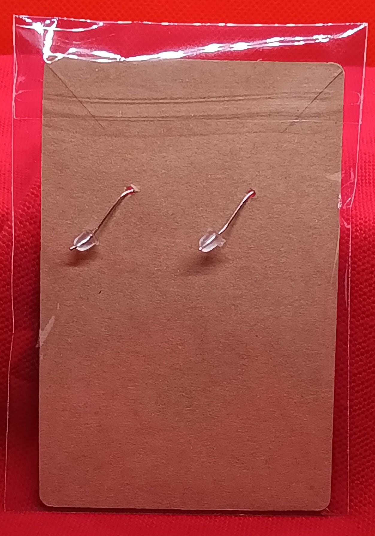 Dinosaur and meteor earrings