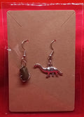 Dinosaur and meteor earrings