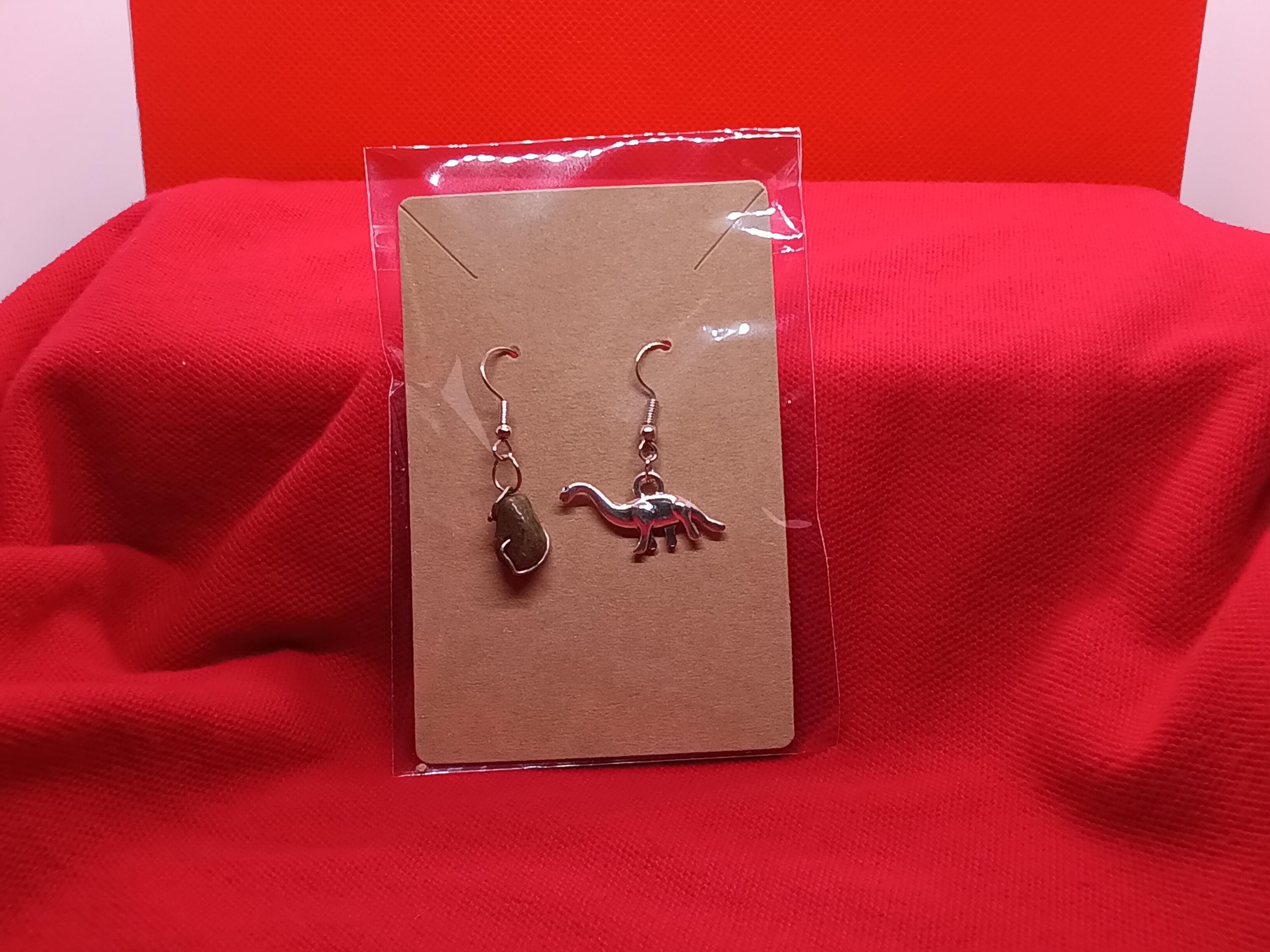 Dinosaur and meteor earrings
