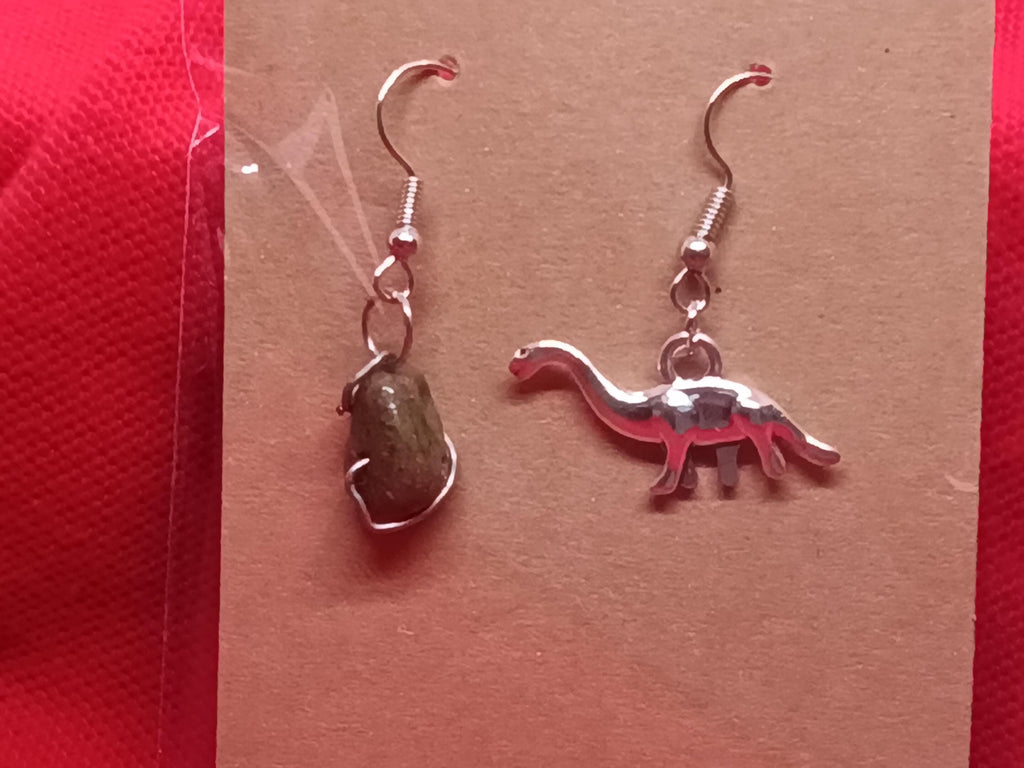 Dinosaur and meteor earrings