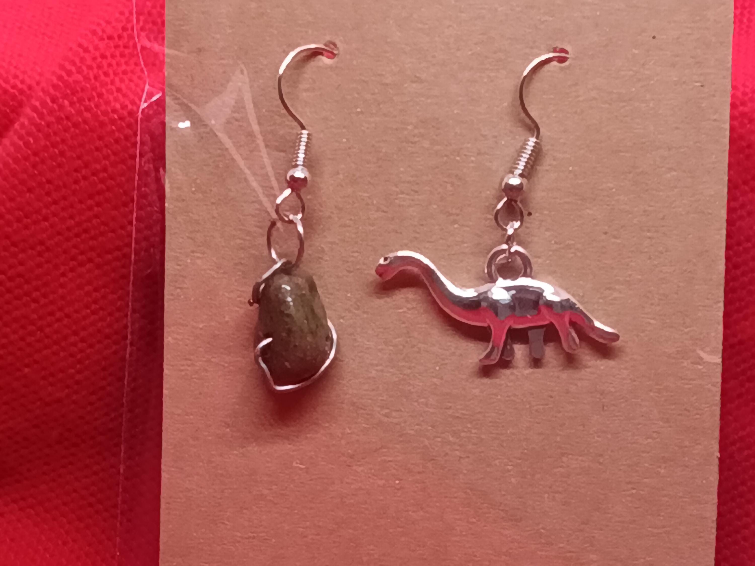 Dinosaur and meteor earrings